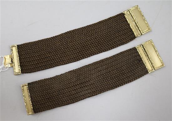 Two 19th century yellow metal mounted plaited hair bracelets, approx. 17.2cm.